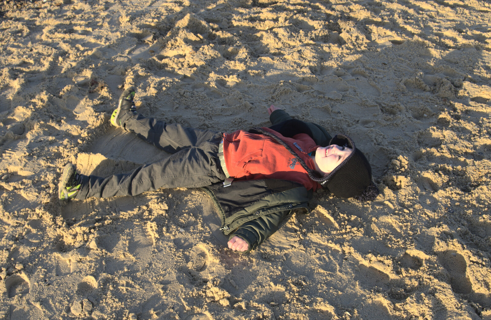 Fred does sand angels from Sunset on the Beach, Southwold, Suffolk - 30th December 2014