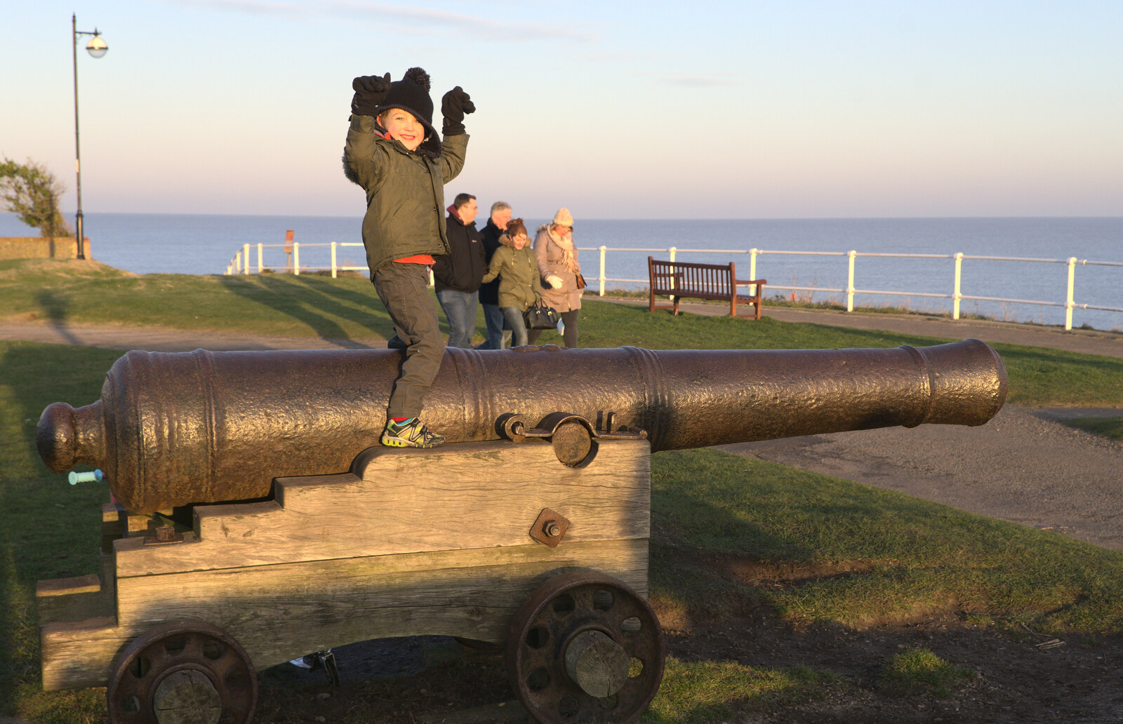 Fred perches on top of a cannon from Sunset on the Beach, Southwold, Suffolk - 30th December 2014