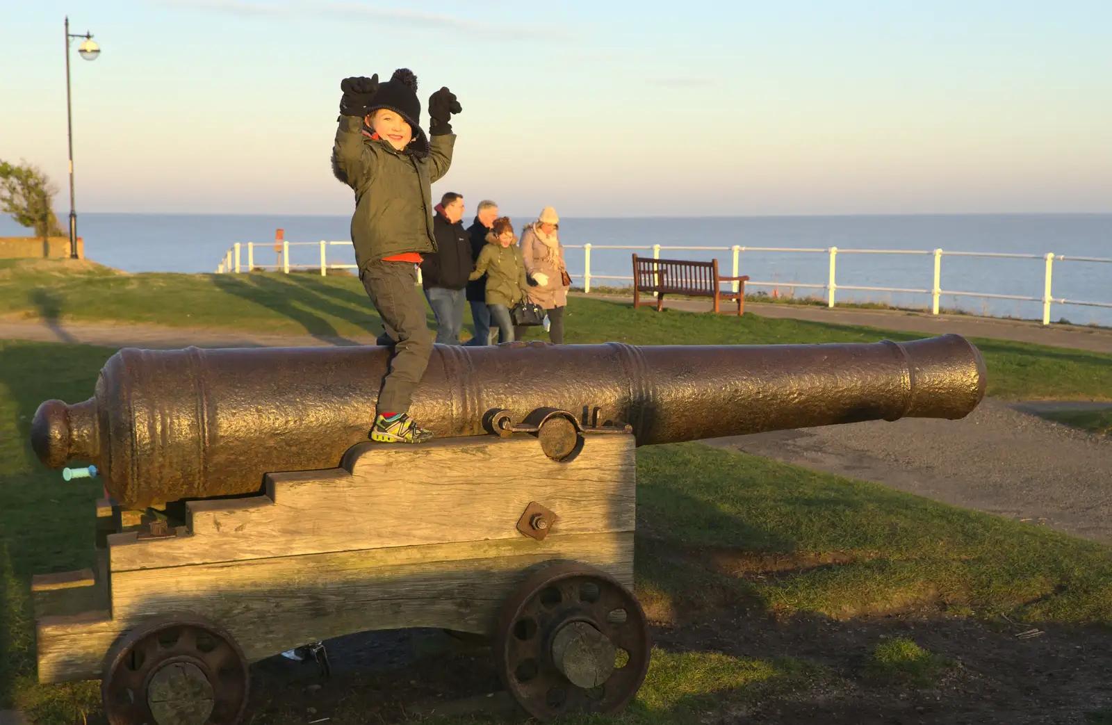 Fred perches on top of a cannon, from Sunset on the Beach, Southwold, Suffolk - 30th December 2014