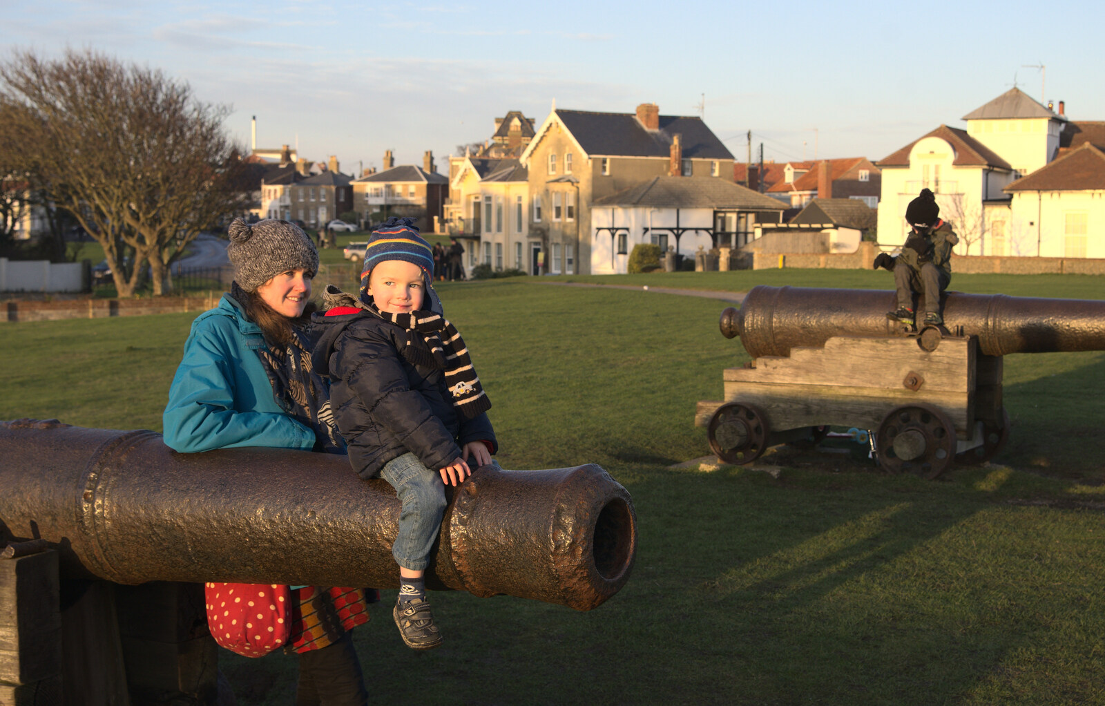 Harry sits on the barrel of a cannon from Sunset on the Beach, Southwold, Suffolk - 30th December 2014