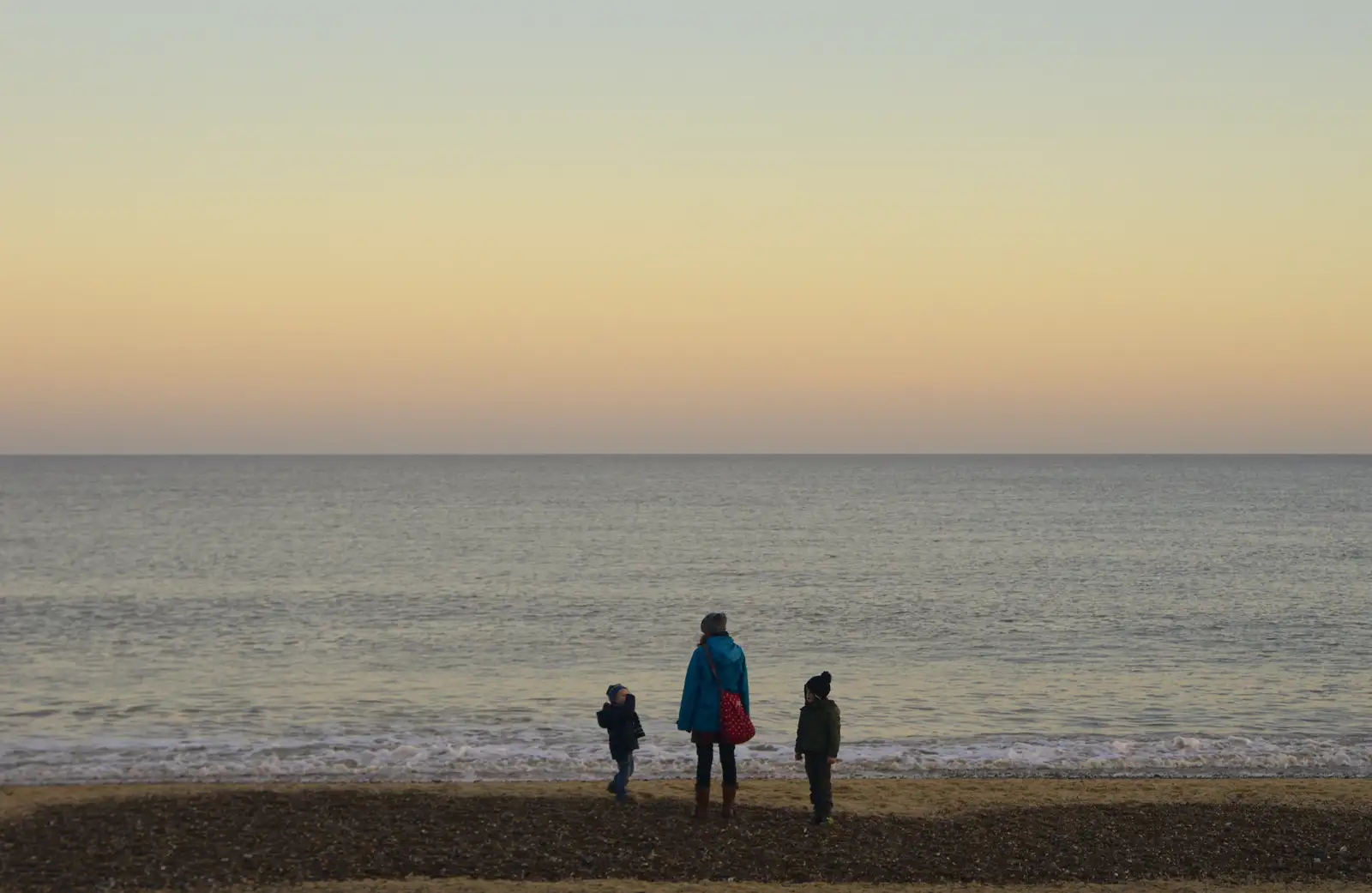 The gang stand by the sea's edge, from Sunset on the Beach, Southwold, Suffolk - 30th December 2014