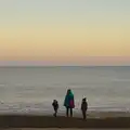 The gang stand by the sea's edge, Sunset on the Beach, Southwold, Suffolk - 30th December 2014