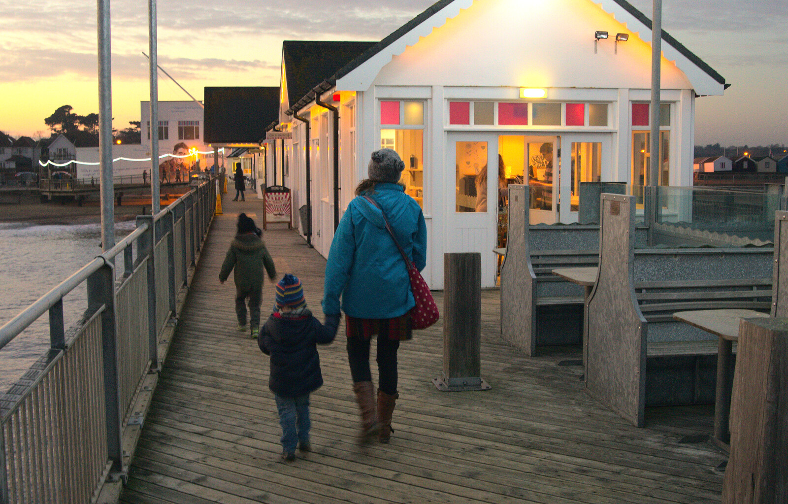 We head back down the pier from Sunset on the Beach, Southwold, Suffolk - 30th December 2014