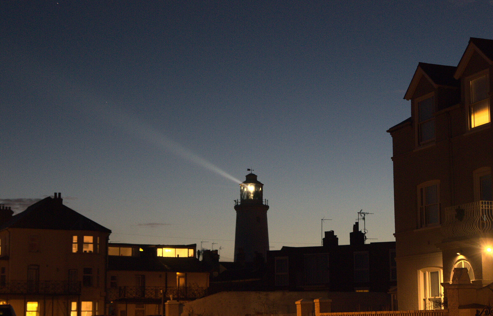 The lighthouse beams out to sea from Sunset on the Beach, Southwold, Suffolk - 30th December 2014