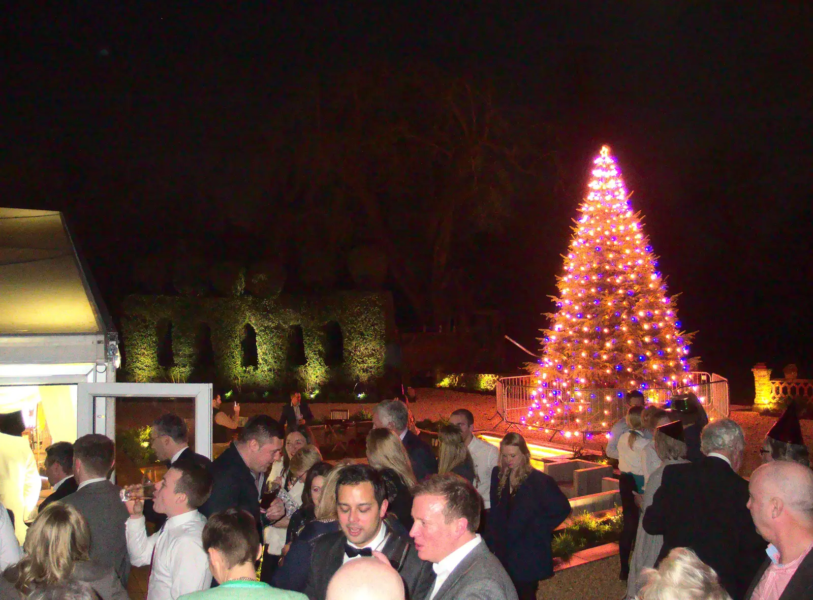 Crowds outside, and the Christmas tree, from New Year's Eve at the Oaksmere, Brome, Suffolk - 31st December 2014