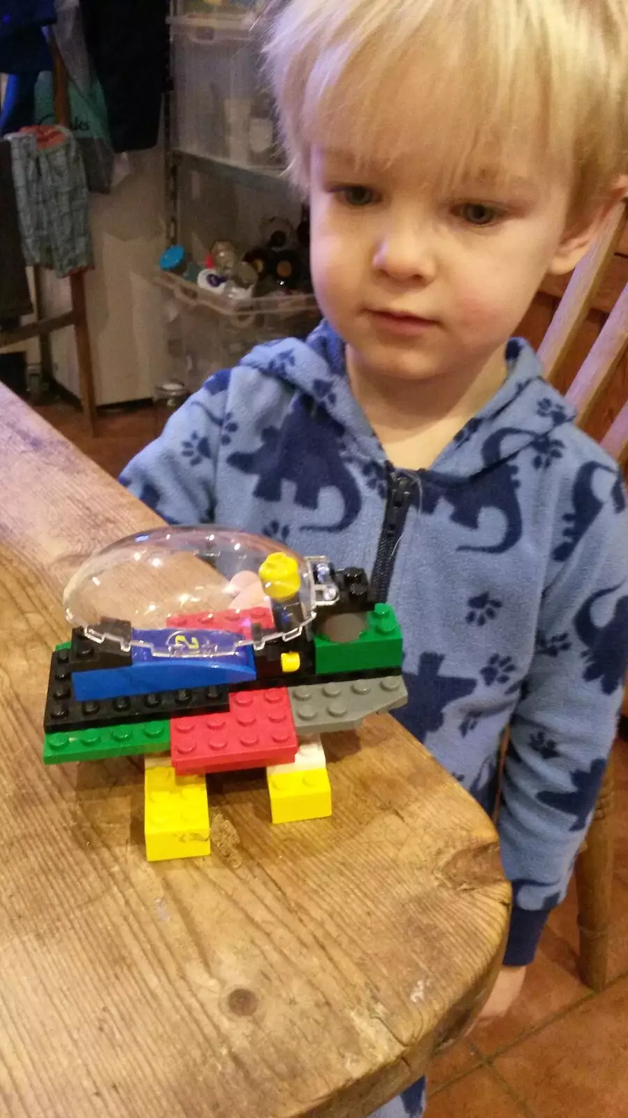 Harry looks at some Lego construction, from A Crashed Car and Greenhouse Demolition, Brome, Suffolk - 20th March 2015