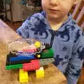 Harry looks at some Lego construction, A Crashed Car and Greenhouse Demolition, Brome, Suffolk - 20th March 2015