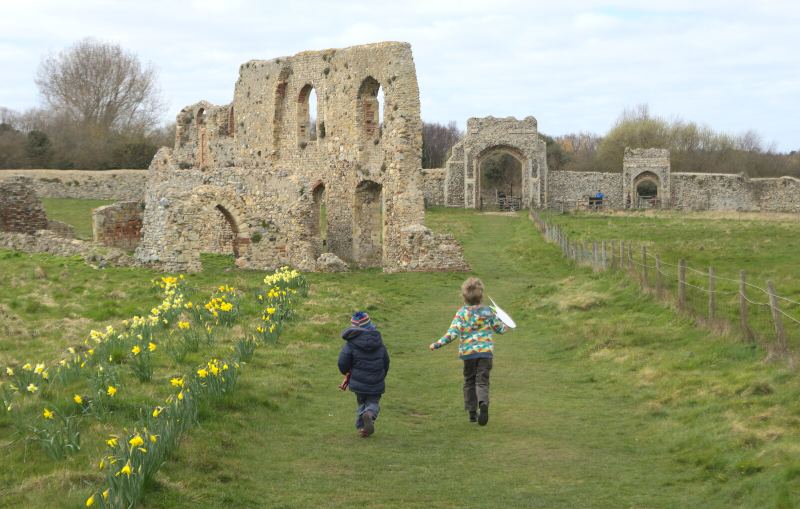 Harry and Fred run down to Dunwich Priory from A Day on the Beach, Dunwich, Suffolk - 6th April 2015