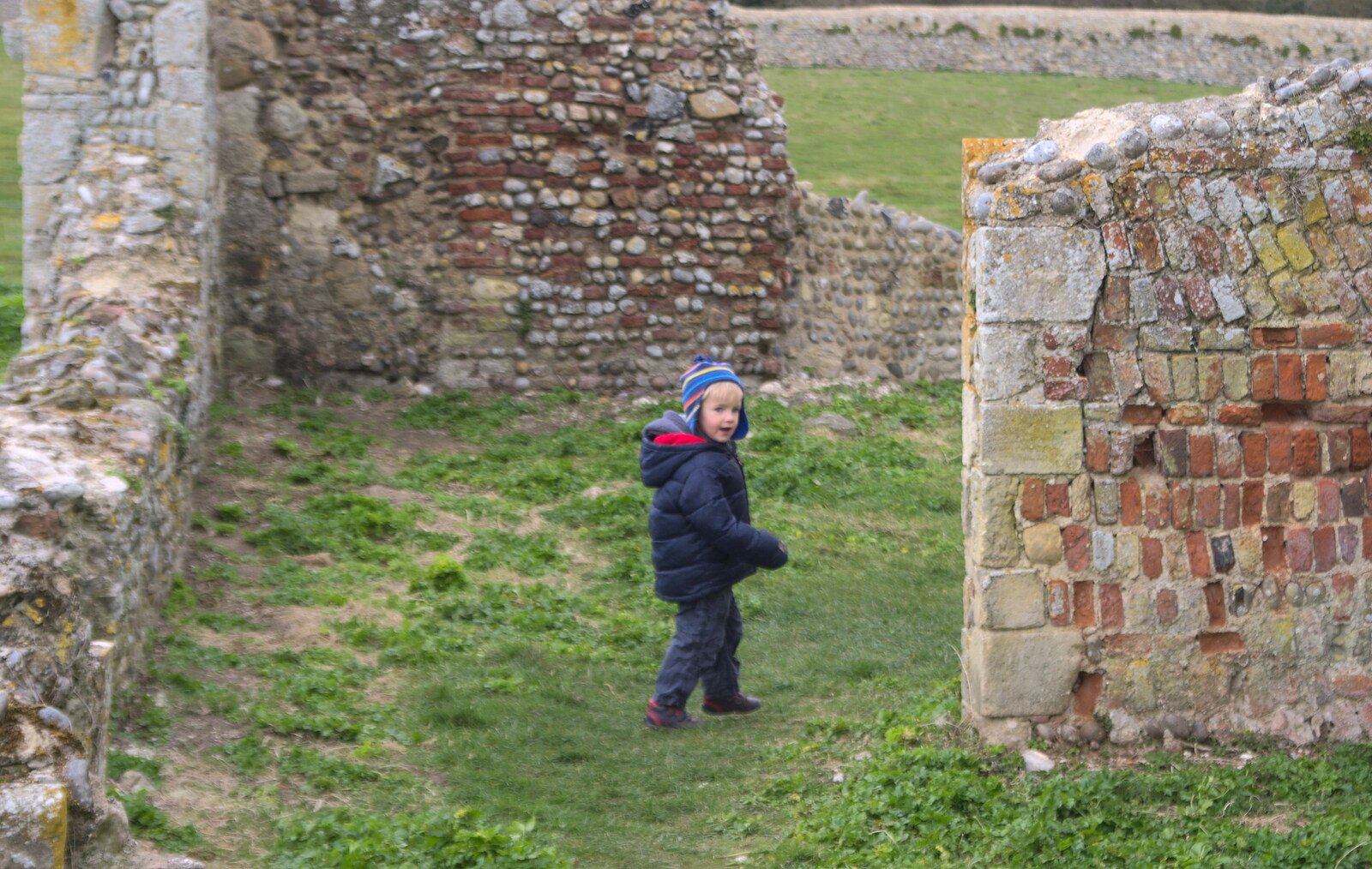 Harry runs around behind a wall from A Day on the Beach, Dunwich, Suffolk - 6th April 2015