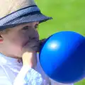 Harry blows a balloon up, James and Haryanna's Wedding, Grand Canal Dock, Dublin - 15th April 2015