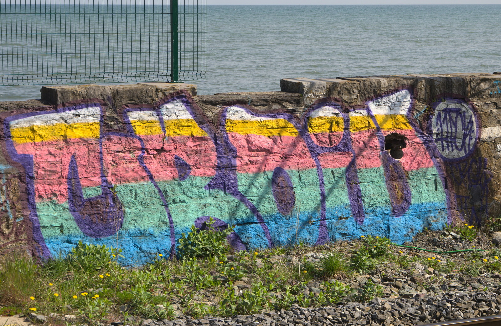 Colourful graffiti at Booterstown DART station from Temple Bar and Dun Laoghaire, Dublin, Ireland - 16th April 2015