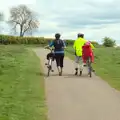 Suey and Isobel push their bikes up a hill, The BSCC Weekend Away, Lyddington, Rutland - 9th May 2015