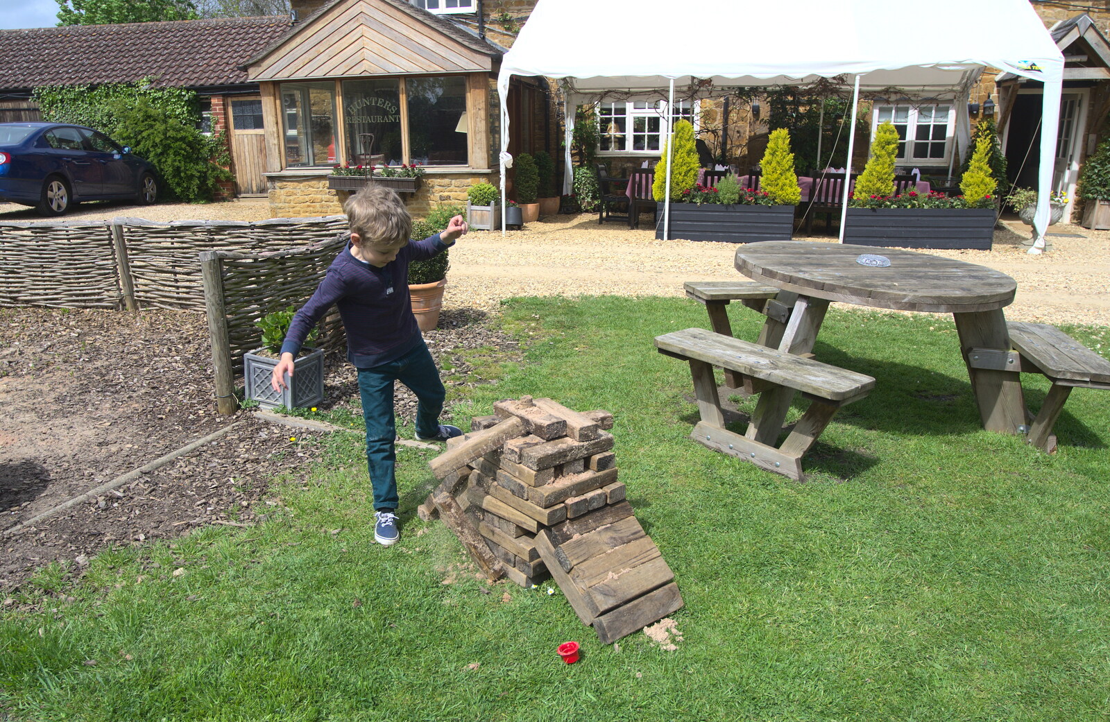 Fred 'helps' the Jenga pile from The BSCC Weekend Away, Lyddington, Rutland - 9th May 2015