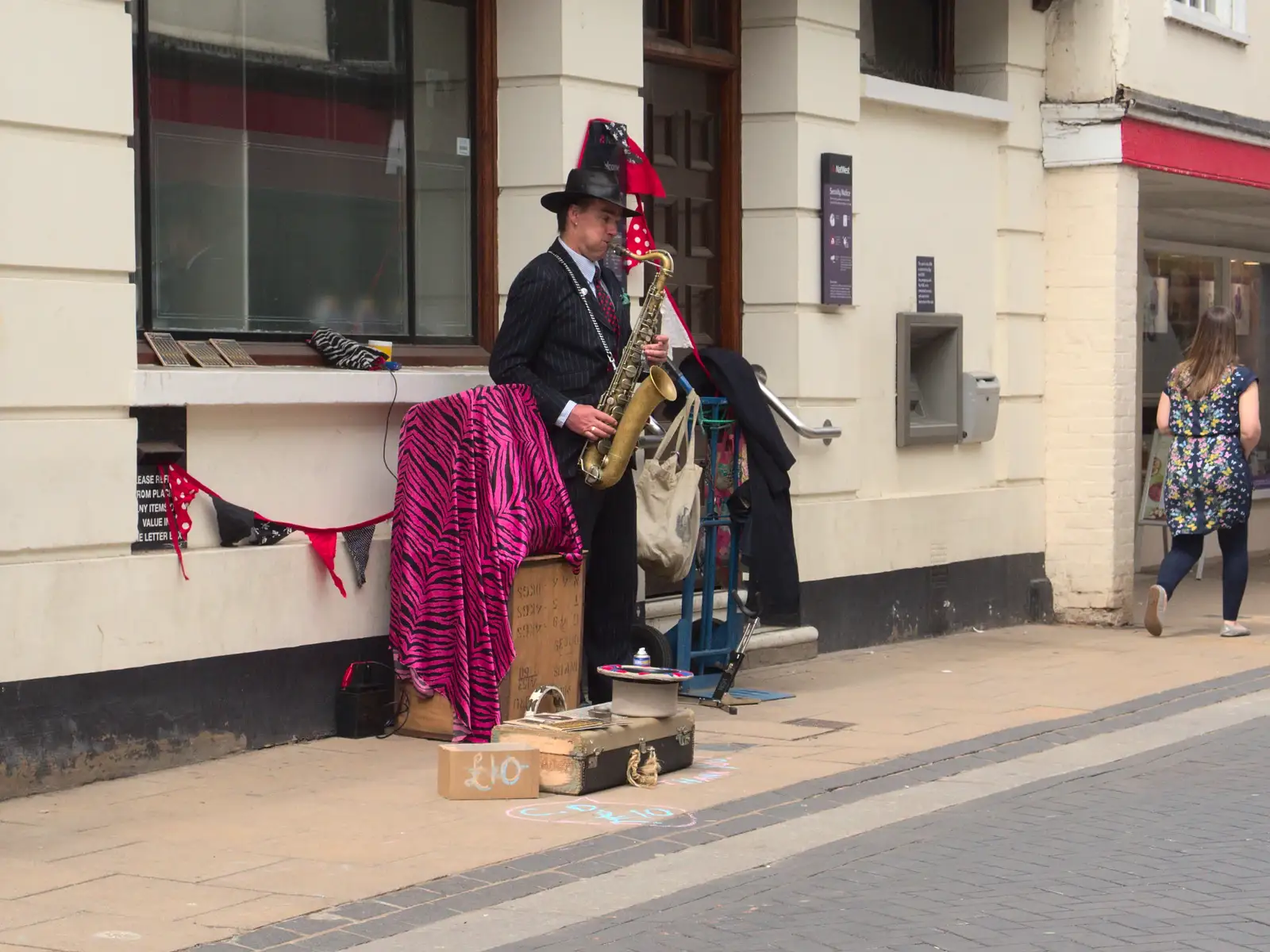 A saxophone player entertains the pedestrians, from A Derelict Petrol Station, Palgrave, Suffolk - 16th May 2015