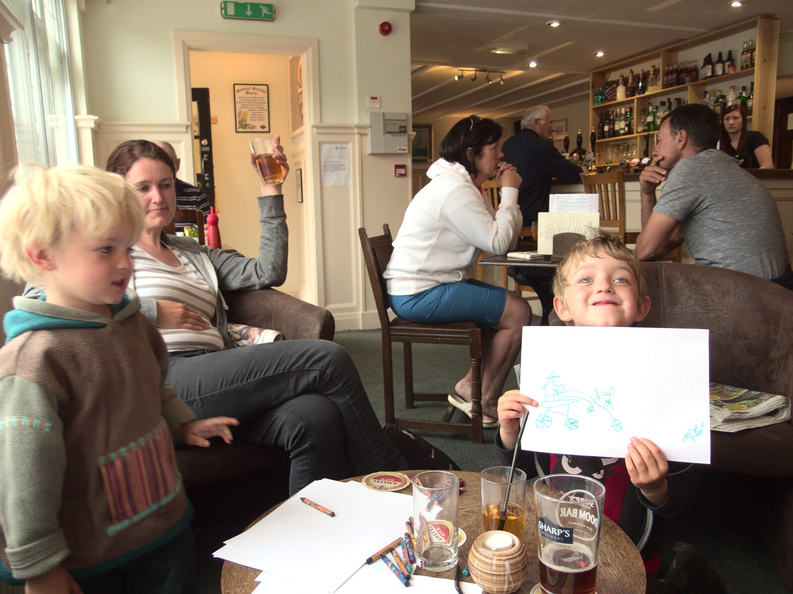 Fred holds up one of his drawings in the pub from A Birthday Camping Trip, East Runton, North Norfolk - 26th May 2015