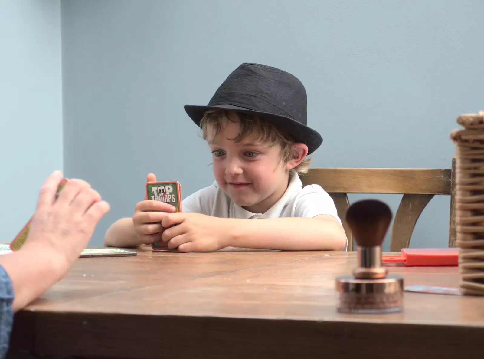 Fred concentrates on his cards, from A visit from Da Gorls, Brome, Suffolk - 27th June 2015