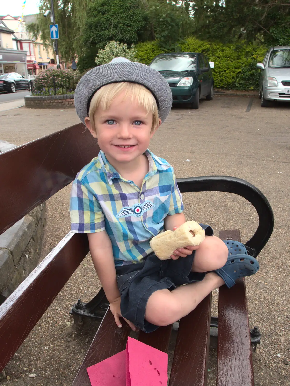 Harry eats one of Andy's sausages, from A visit from Da Gorls, Brome, Suffolk - 27th June 2015