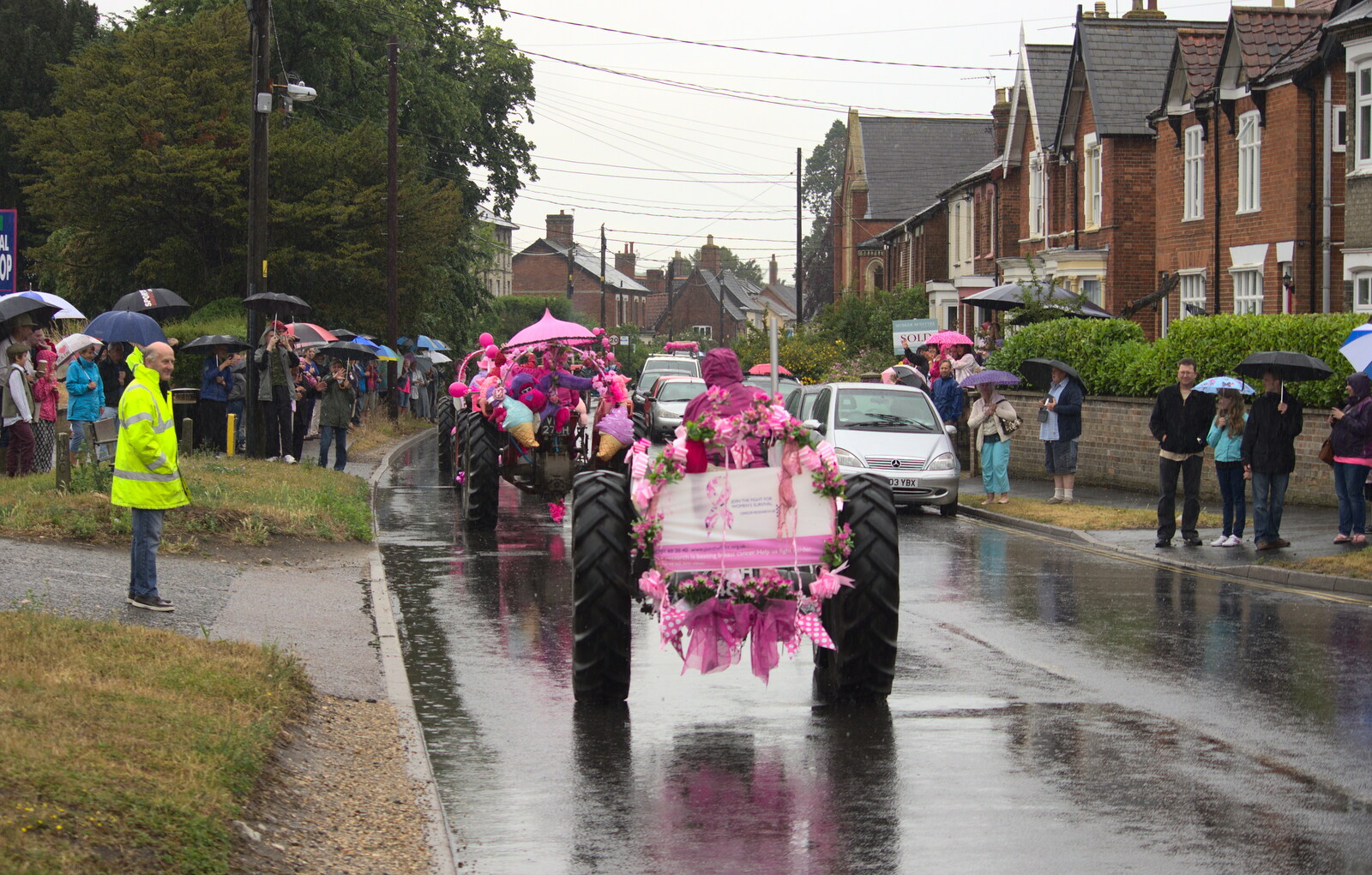 Tractors head into Harleston from The Pink Ladies Tractor Run, Harleston and Gawdy Park, Norfolk - 5th July 2015