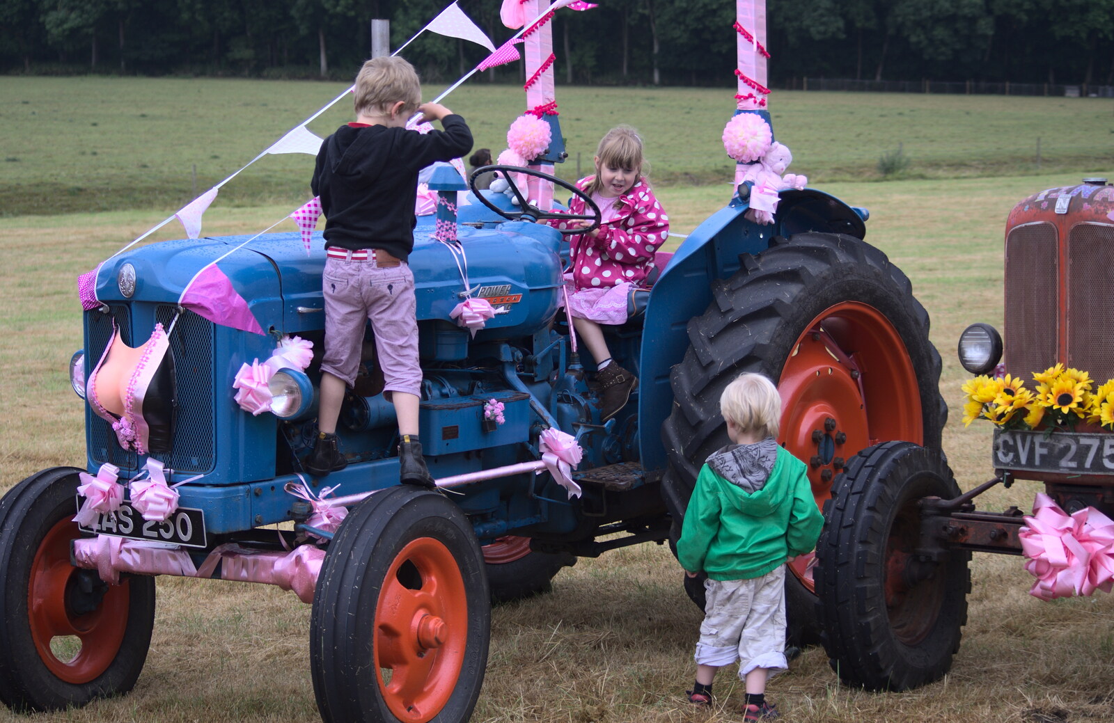 The children climb all over the tractors from The Pink Ladies Tractor Run, Harleston and Gawdy Park, Norfolk - 5th July 2015