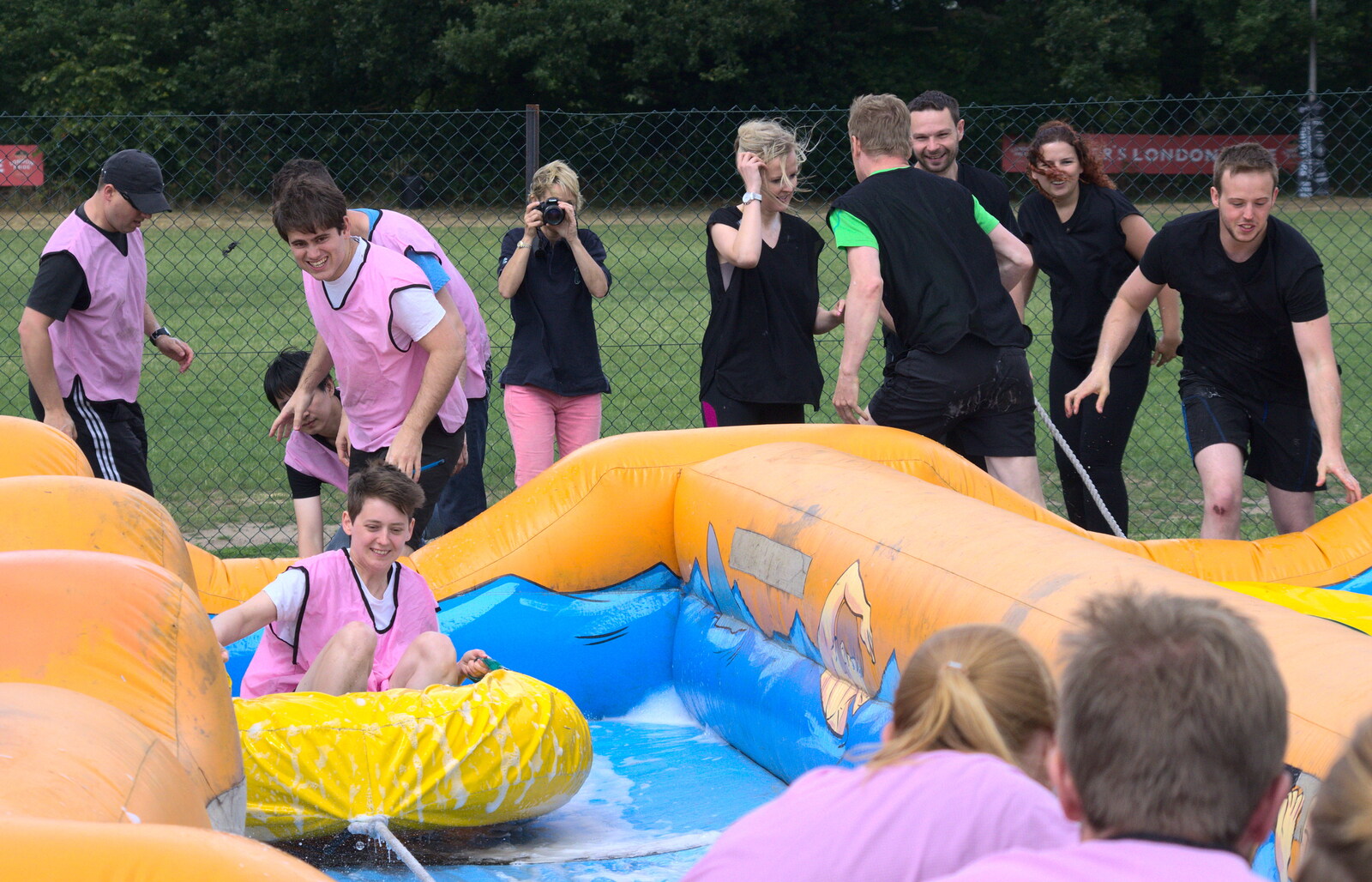 Jess comes down the slide from It's a SwiftKey Knockout, Richmond Rugby Club, Richmond, Surrey - 7th July 2015