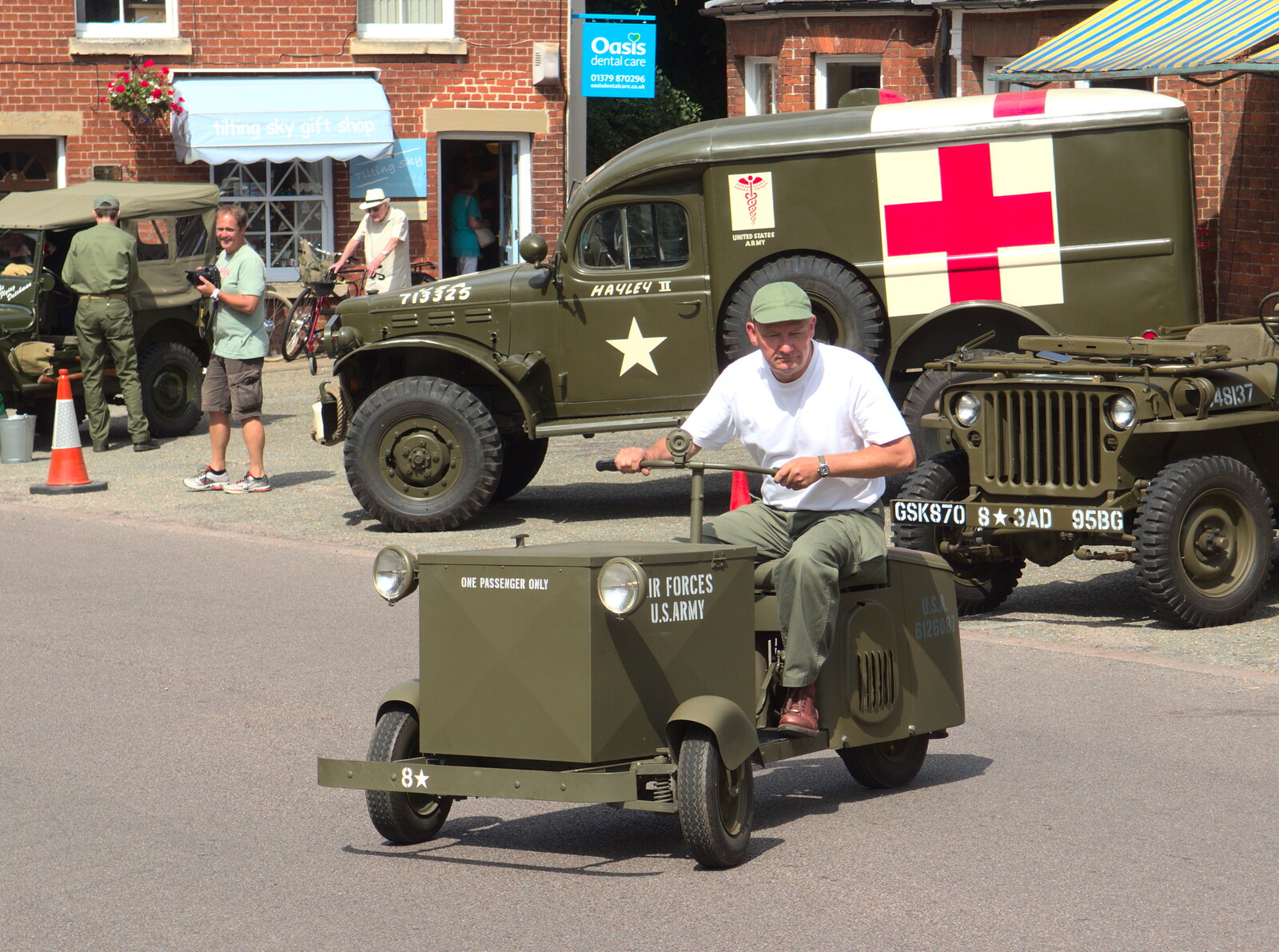 A curious motor-tricycle trundles around from A 1940's Takeover, Eye, Suffolk - 8th August 2015