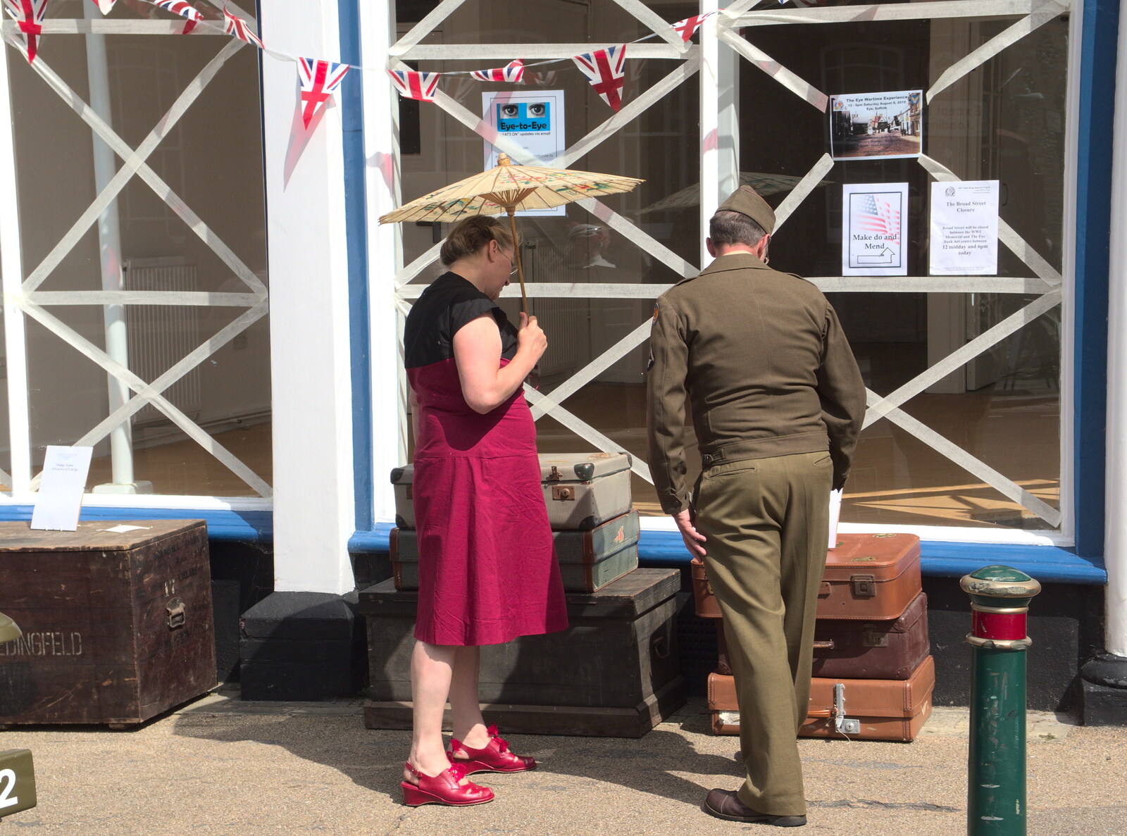 Eyeing up a pile of vintage suitcases from A 1940's Takeover, Eye, Suffolk - 8th August 2015