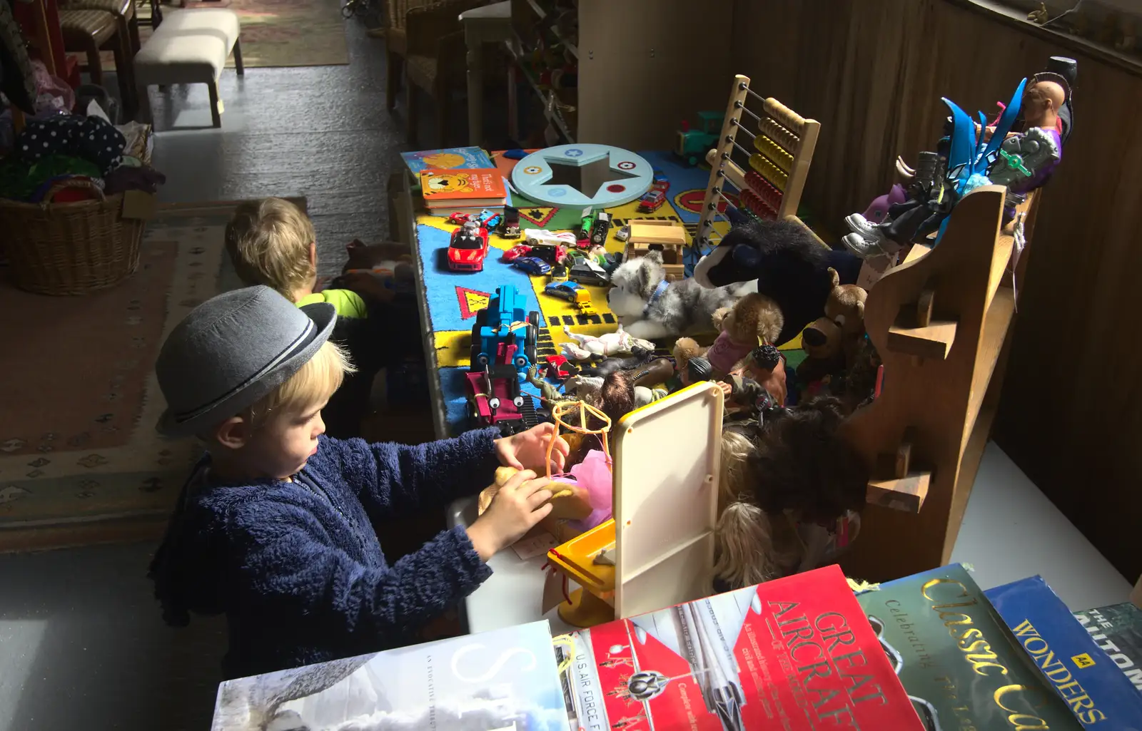 The boys check out the toy table, from Camping at Roundhills, Brockenhurst, New Forest, Hampshire - 29th August 2015