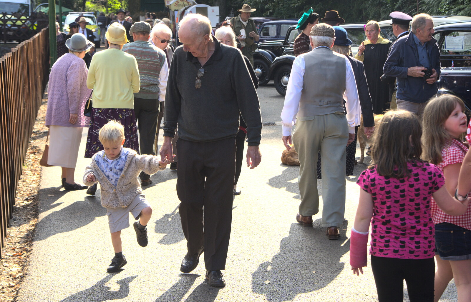 Harry stomps around with Grandad in tow from A Steamy 1940s Day Out, Holt and Sheringham, Norfolk - 20th September 2015