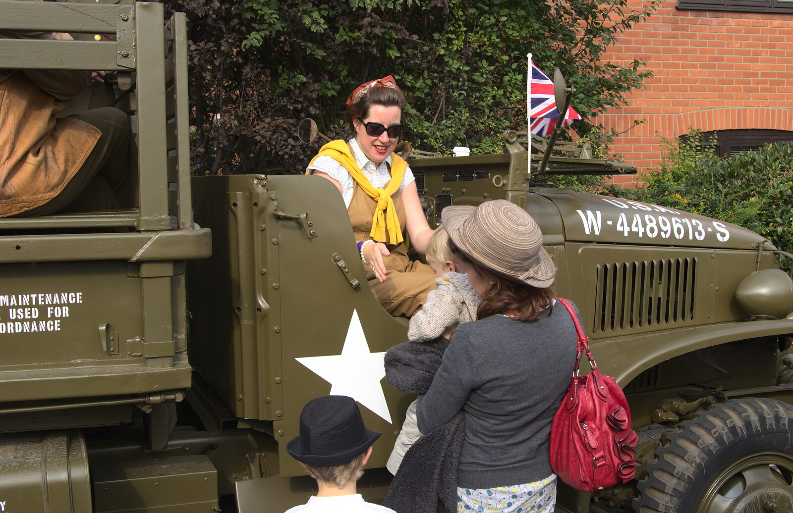 Suzanne lifts Harry up from A Steamy 1940s Day Out, Holt and Sheringham, Norfolk - 20th September 2015