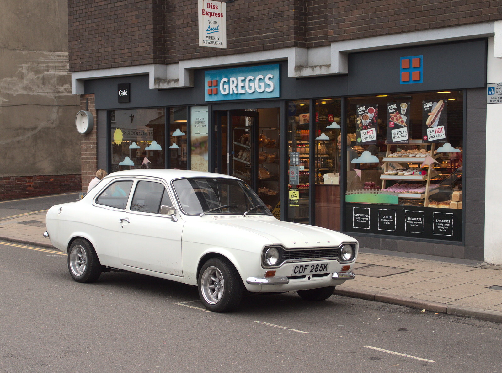 There's a nice Mark 1 Escort outside Gregg's from Fred's Gyrobot, Brome, Suffolk - 18th October 2015