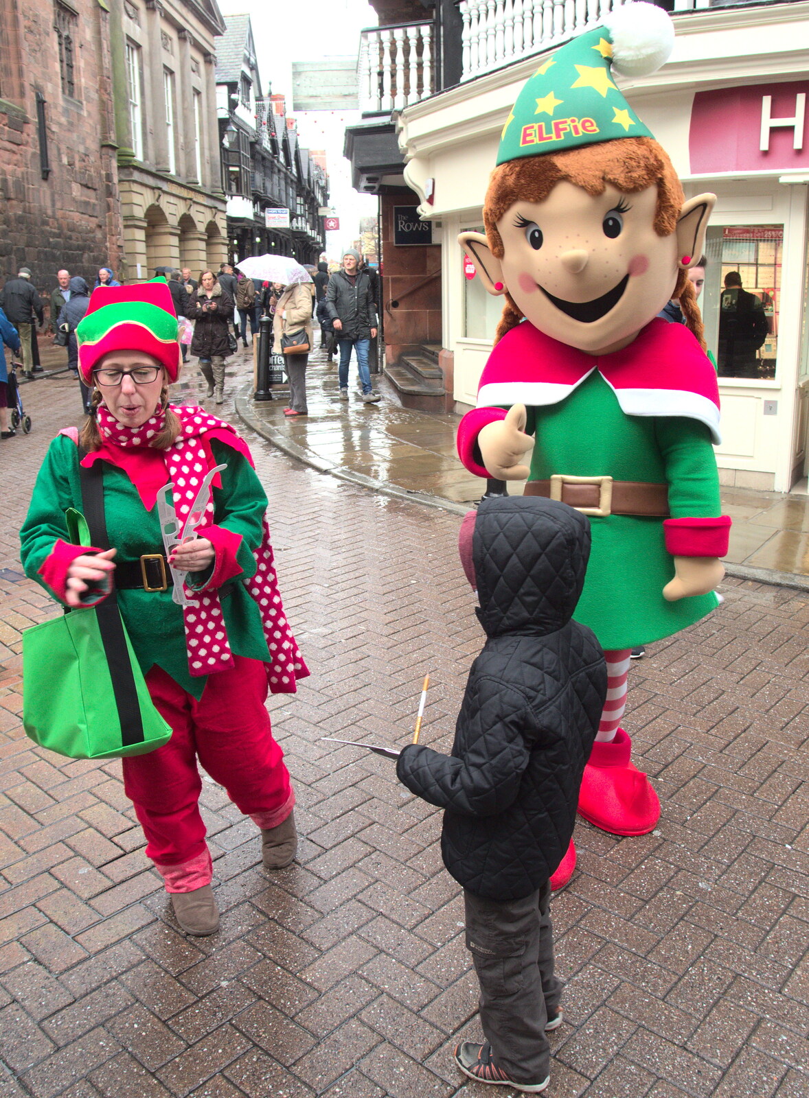 A giant elf is handing out mysterious glasses from A Party and a Road Trip to Chester, Suffolk and Cheshire - 20th December 2015