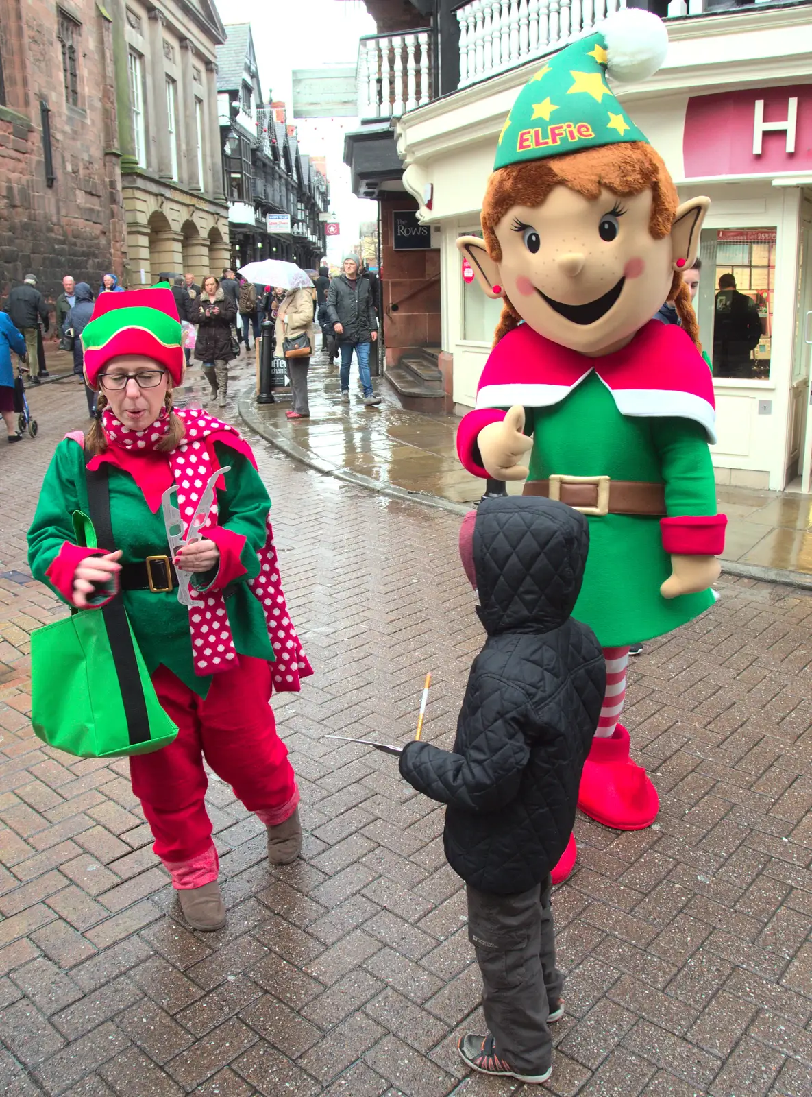 A giant elf is handing out mysterious glasses, from A Party and a Road Trip to Chester, Suffolk and Cheshire - 20th December 2015