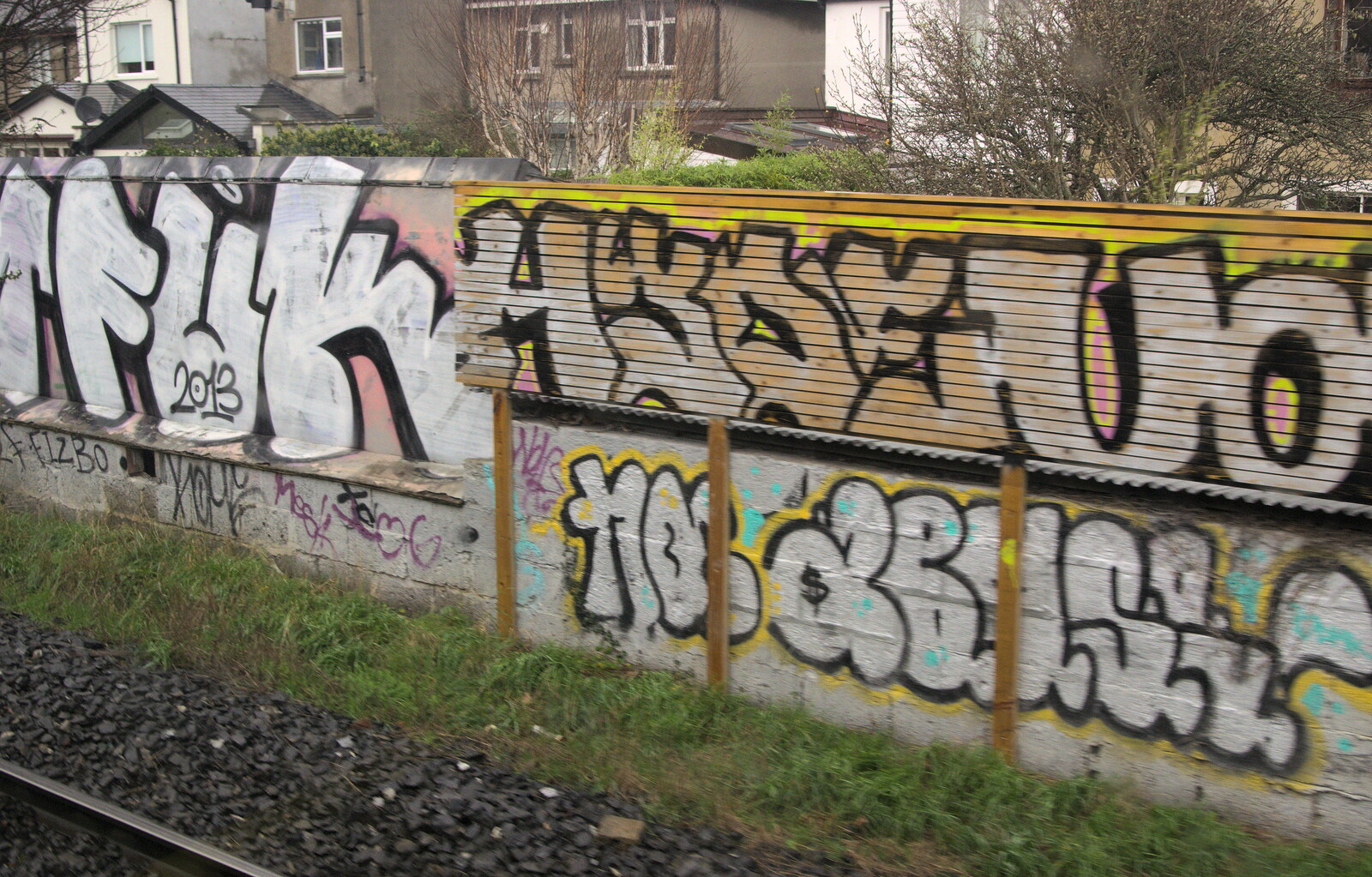 Trackside graffiti as we head into Dublin from Christmas Eve in Dublin and Blackrock, Ireland - 24th December 2015