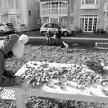 Isobel writes on a pebble, A Trip to Aldeburgh, Suffolk - 7th February 2016