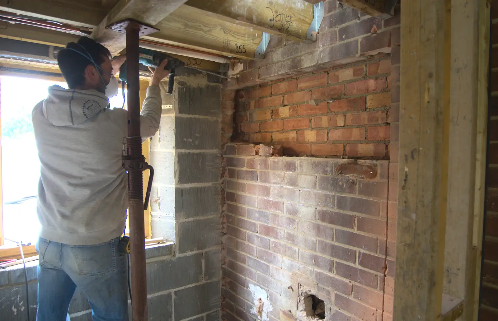 Brian drills through the wall into the house, from A SwiftKey Power Cut, Southwark Bridge Road, London - 4th March 2016