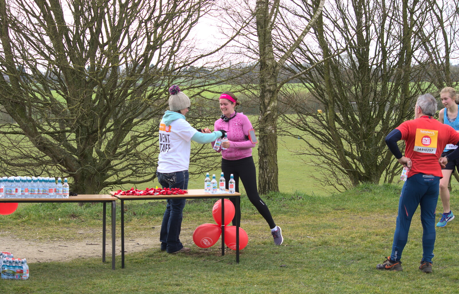 Isobel gets some water after finishing from Isobel's Hartismere Run, Castleton Way, Eye, Suffolk - 16th March 2016