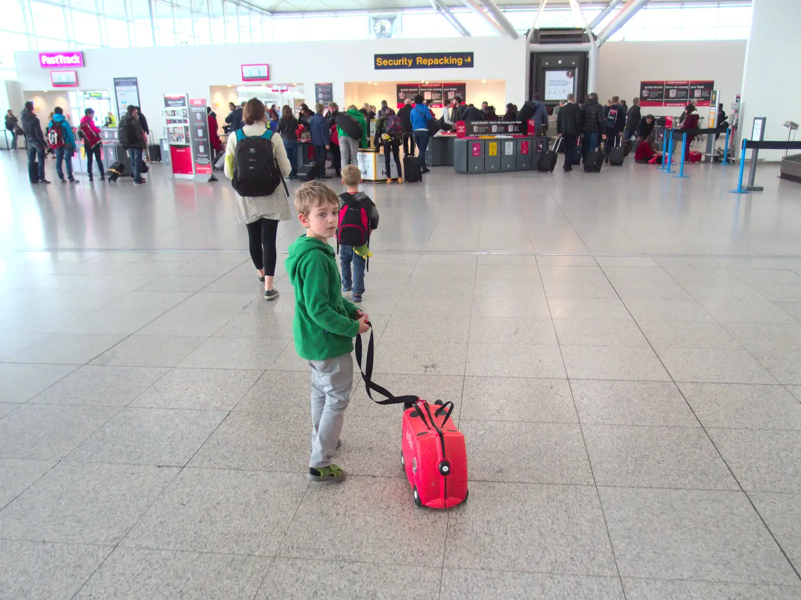 Fred hauls his Trunki around the check-in area, from A Trip to Albufeira: The Hotel Paraiso, Portugal - 3rd April 2016