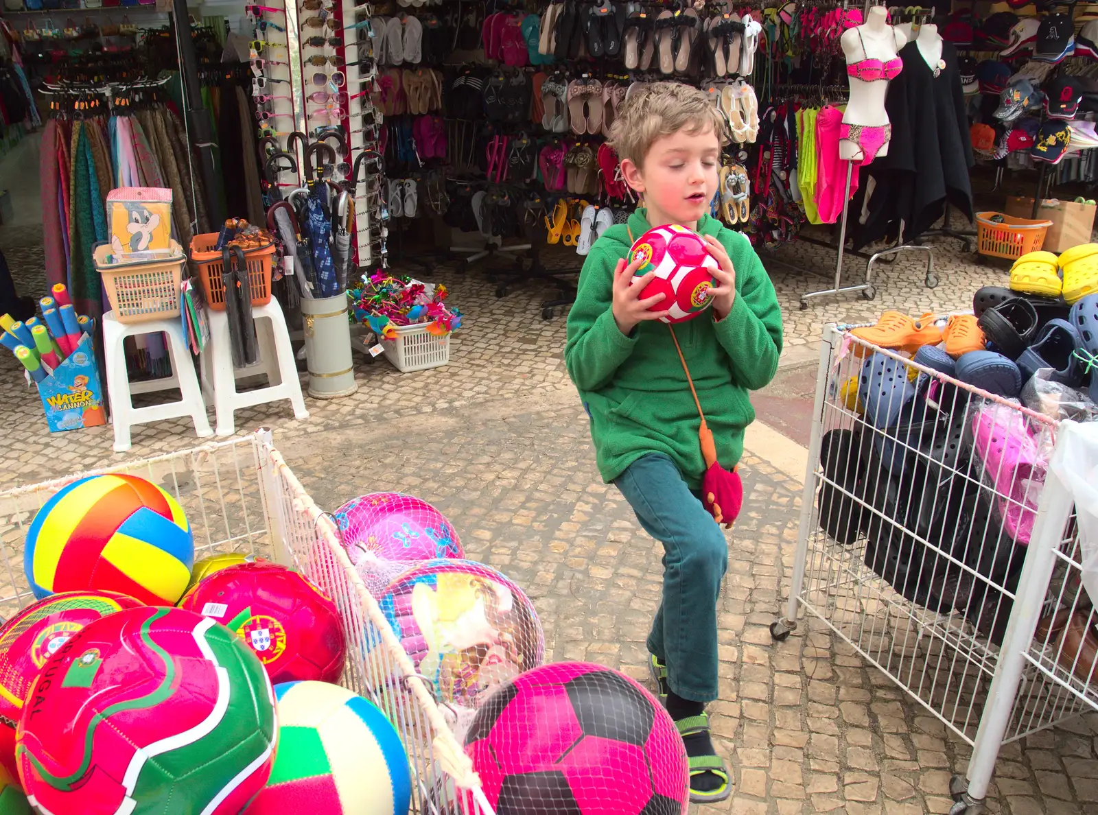 Fred picks up a Portugal football, from A Trip to Albufeira: The Hotel Paraiso, Portugal - 3rd April 2016