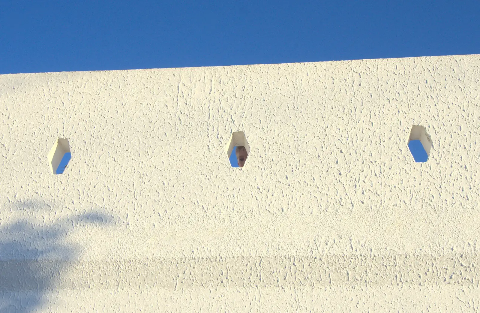 Harry peeps out cheekily from the balcony, from Gary and Vanessa's Barbeque, Alcantarilha, Algarve, Portugal - 7th April 2016