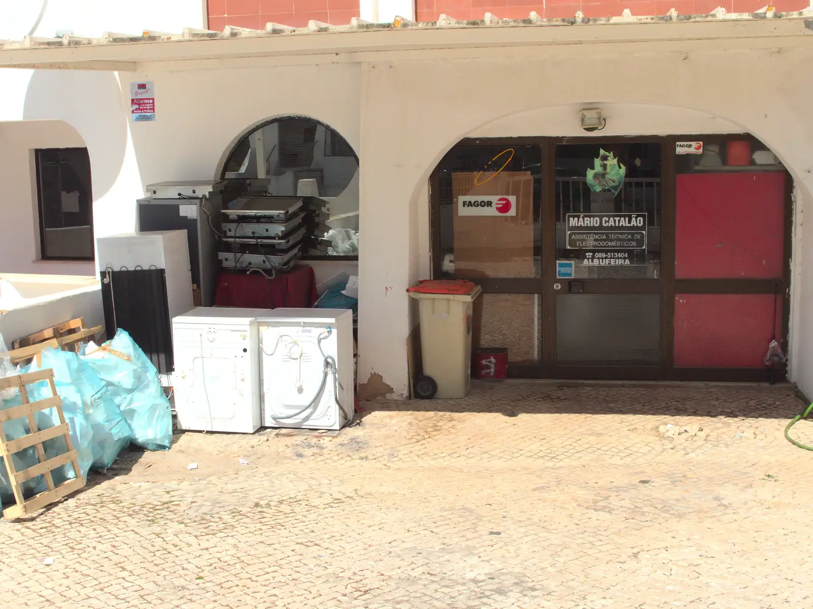 Discarded white goods outside a café, from Last Days and the Journey Home, Albufeira, Portugal - 9th April 2016