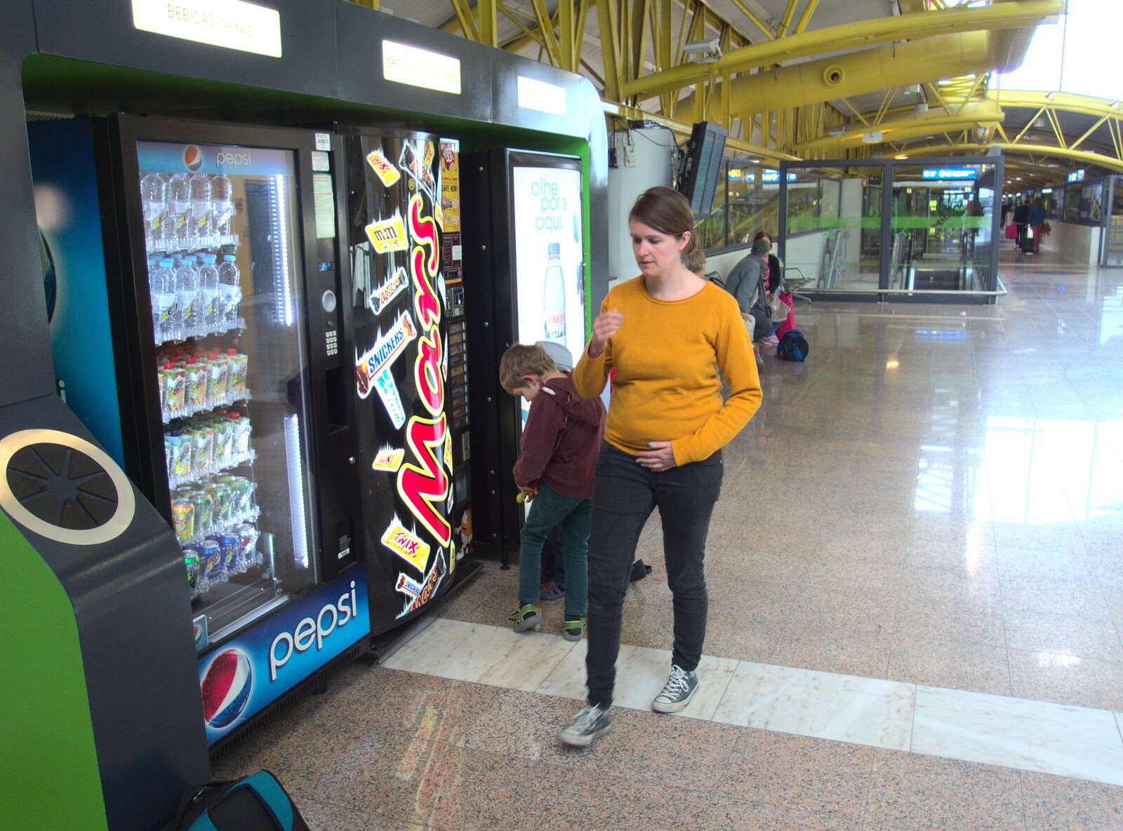 Isobel roams around by the vending machines from Last Days and the Journey Home, Albufeira, Portugal - 9th April 2016
