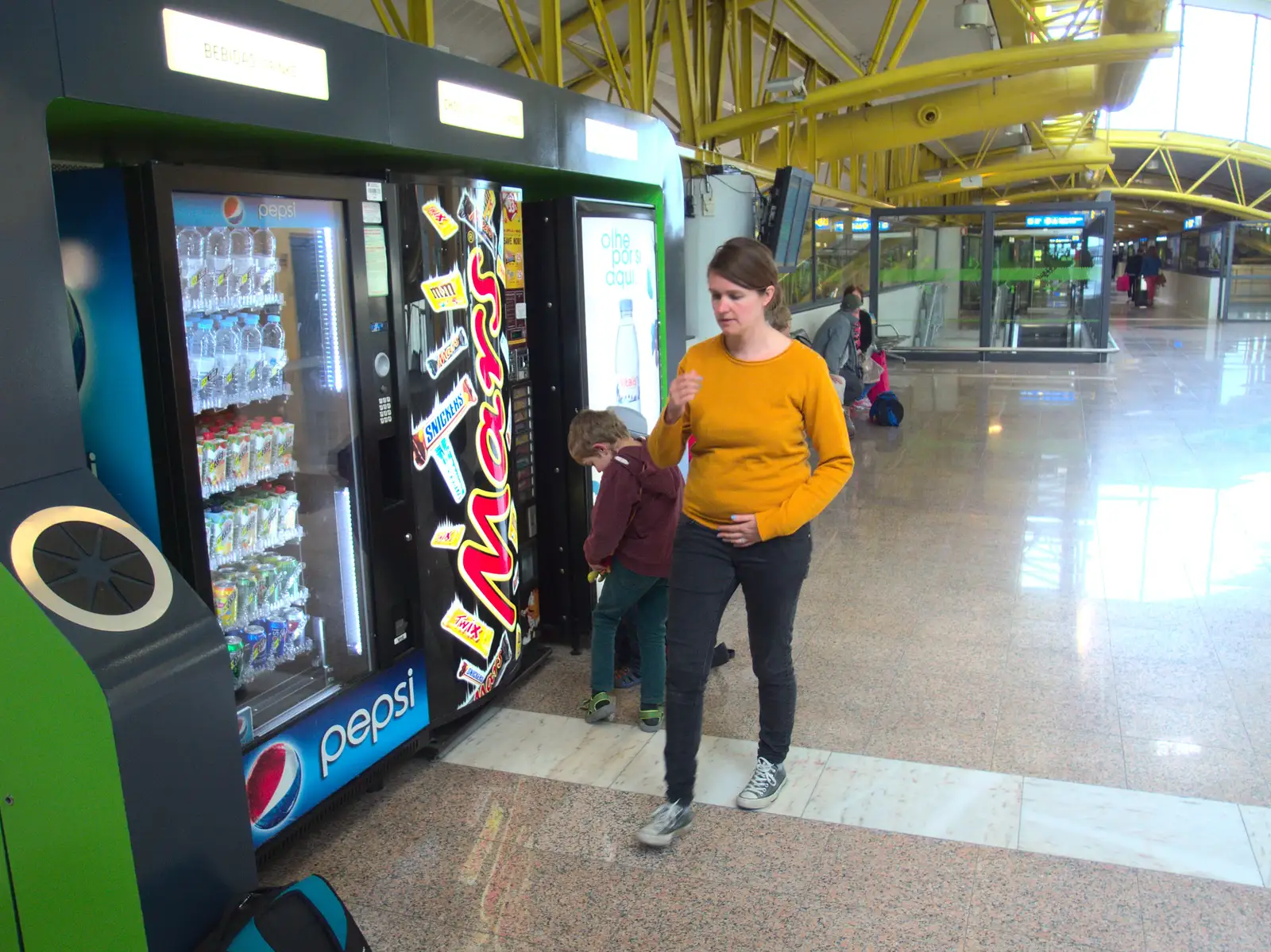 Isobel roams around by the vending machines, from Last Days and the Journey Home, Albufeira, Portugal - 9th April 2016