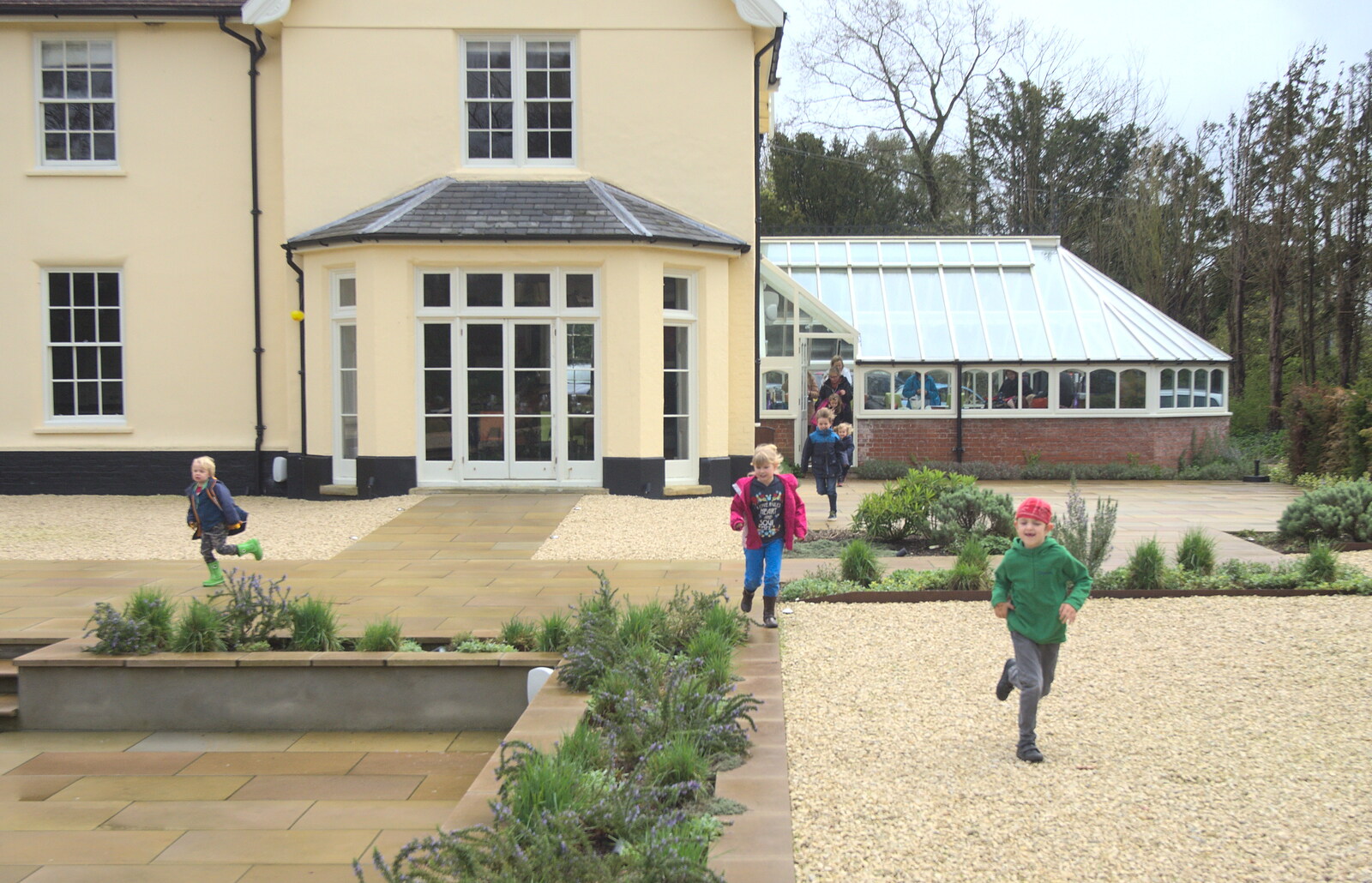 The children burst out of the conservatory from Harry's Pirate Party, The Oaksmere, Brome, Suffolk - 16th April 2016