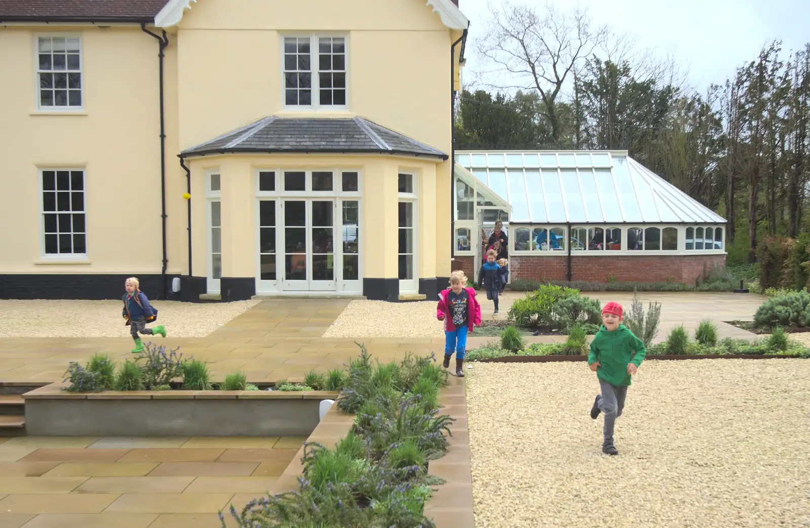 The children burst out of the conservatory, from Harry's Pirate Party, The Oaksmere, Brome, Suffolk - 16th April 2016