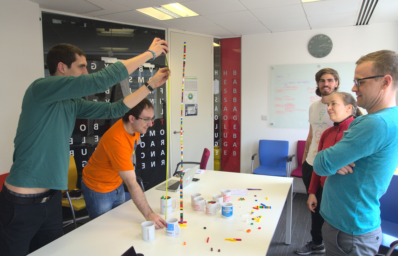 Lachie and Fran measure a Lego tower from A SwiftKey Innovation Week, Southwark, London - 22nd April 2016
