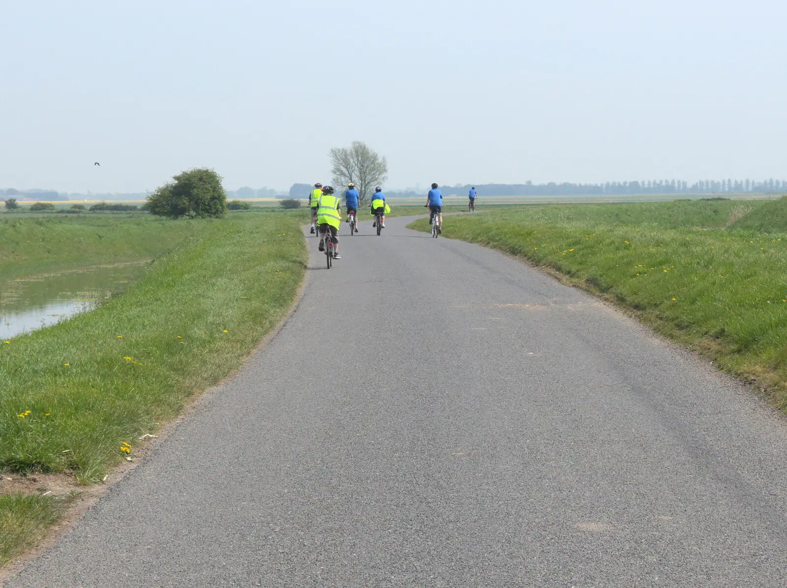 Cyclists disappear into the Fens, from The BSCC Cycling Weekender, Outwell, West Norfolk - 7th May 2016