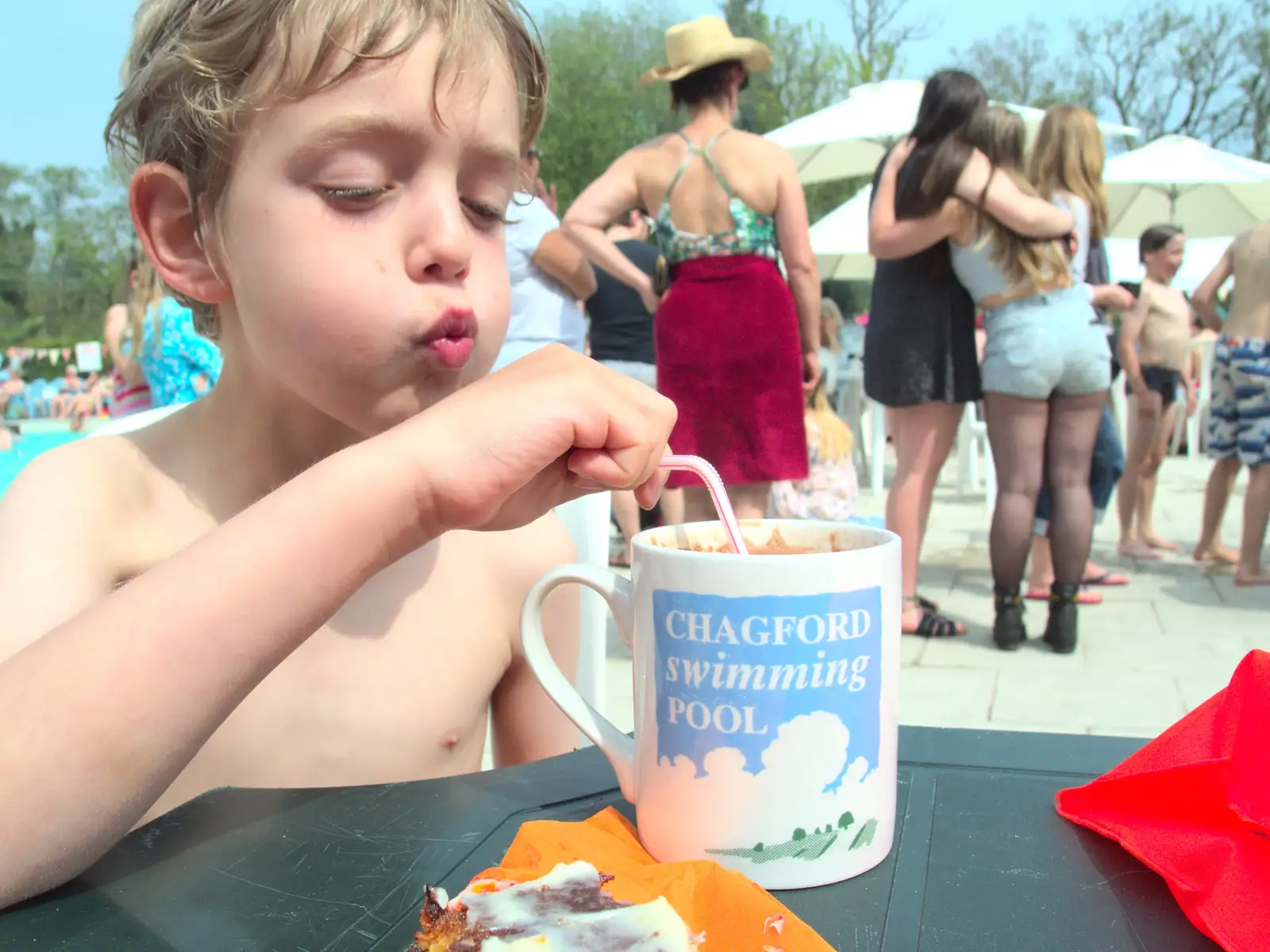 Fred blows on his free mug of hot chocolate, from The Grand Re-opening of the Chagford Lido, Chagford, Devon - 28th May 2016