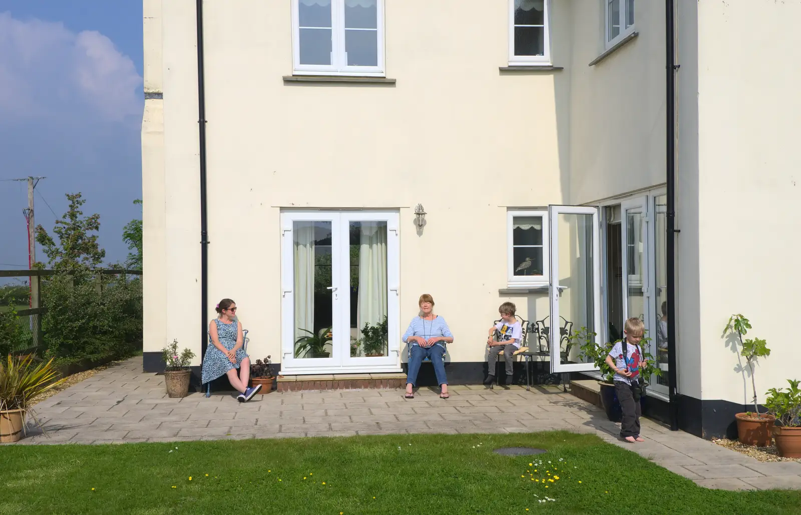 Isobel, Mother and The Boys sit in the sun, from A Visit to Okehampton Castle and Dartmoor, Devon  - 28th May 2016