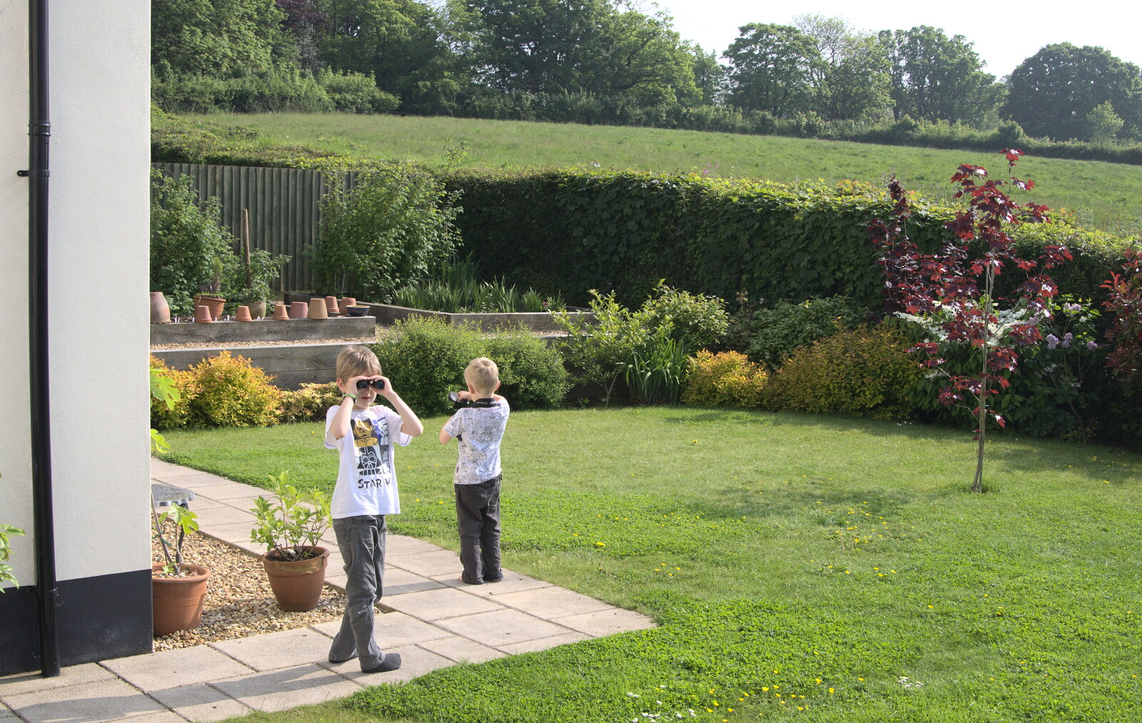 Fred and Harry peer around with binoculars from A Visit to Okehampton Castle and Dartmoor, Devon  - 28th May 2016