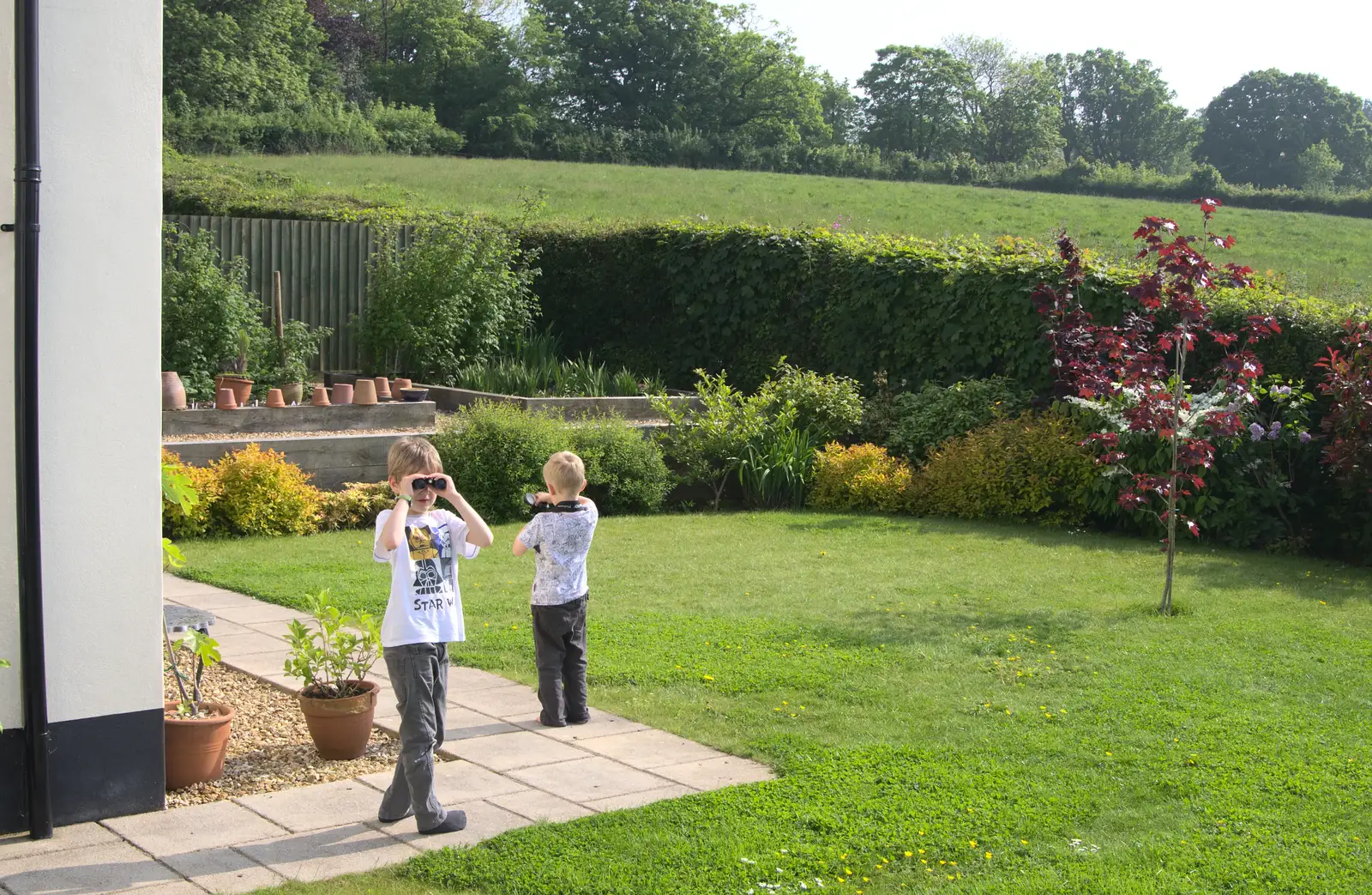 Fred and Harry peer around with binoculars, from A Visit to Okehampton Castle and Dartmoor, Devon  - 28th May 2016